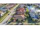 Aerial view of a luxury home with lake access at 2564 Grand Cypress Blvd, Palm Harbor, FL 34684