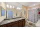 Bathroom with double vanity and shower/tub combo at 2564 Grand Cypress Blvd, Palm Harbor, FL 34684