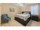 Bedroom with king-size bed and nightstand at 2564 Grand Cypress Blvd, Palm Harbor, FL 34684