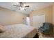 Large bedroom with king bed and ceiling fan at 2564 Grand Cypress Blvd, Palm Harbor, FL 34684