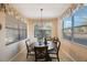 Bright breakfast nook with a round table and chairs, perfect for enjoying meals at 2564 Grand Cypress Blvd, Palm Harbor, FL 34684
