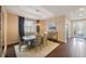 Elegant dining room with wood floors and chandelier at 2564 Grand Cypress Blvd, Palm Harbor, FL 34684