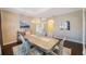 Bright dining room features a large table, chandelier, and hardwood floors at 2564 Grand Cypress Blvd, Palm Harbor, FL 34684