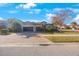 House exterior with two-car garage and well-maintained landscaping at 2564 Grand Cypress Blvd, Palm Harbor, FL 34684