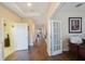 Bright hallway with access to various rooms at 2564 Grand Cypress Blvd, Palm Harbor, FL 34684