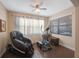 Bright home gym with a massage chair and elliptical at 2564 Grand Cypress Blvd, Palm Harbor, FL 34684