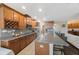 Island kitchen with granite countertops and stainless steel appliances at 2564 Grand Cypress Blvd, Palm Harbor, FL 34684