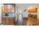 Modern kitchen with granite countertops and wooden cabinets at 2564 Grand Cypress Blvd, Palm Harbor, FL 34684