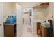 Laundry room with washer, dryer, and ample storage space at 2564 Grand Cypress Blvd, Palm Harbor, FL 34684