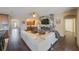 Open living room with hardwood floors, fireplace, and access to kitchen at 2564 Grand Cypress Blvd, Palm Harbor, FL 34684