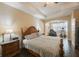 Main bedroom with king-size bed, a TV, and room for exercise equipment at 2564 Grand Cypress Blvd, Palm Harbor, FL 34684