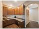 Home office with granite countertop and wood cabinets at 2564 Grand Cypress Blvd, Palm Harbor, FL 34684