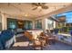 Covered patio with hot tub and outdoor seating at 2564 Grand Cypress Blvd, Palm Harbor, FL 34684