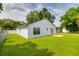 Newly built home with a spacious backyard and grassy lawn at 3123 W Rio Vista Ave, Tampa, FL 33614