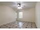 Well-lit bedroom with ceiling fan and mirrored closet doors at 3123 W Rio Vista Ave, Tampa, FL 33614