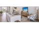 Spacious living room featuring a large TV and comfortable seating at 32443 Osprey Peak Way, San Antonio, FL 33576
