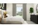 Bright bedroom with gray curtains and a black dresser at 35233 Gravelly Dr, Zephyrhills, FL 33541