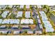 Aerial view of condo building with parking and surrounding landscape at 4231 Tamargo Dr # 3, New Port Richey, FL 34652