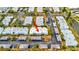 Aerial view of condo building with parking and surrounding landscape at 4231 Tamargo Dr # 3, New Port Richey, FL 34652