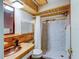 Bathroom with wood cabinets, copper sink, and marble shower at 4231 Tamargo Dr # 3, New Port Richey, FL 34652