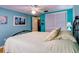 Bedroom with teal walls, wood floors, and a metal bed frame at 4231 Tamargo Dr # 3, New Port Richey, FL 34652