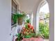 Covered entryway with arched details and potted plants at 4231 Tamargo Dr # 3, New Port Richey, FL 34652