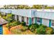 Condo exterior showcasing light blue accents and landscaping at 4231 Tamargo Dr # 3, New Port Richey, FL 34652