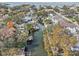 Stunning aerial view of a waterfront neighborhood with canals and private boat docks on a sunny day at 4829 W San Miguel St, Tampa, FL 33629