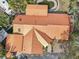 Aerial view of a home with a distinctive metal roof and a backyard pool oasis at 4829 W San Miguel St, Tampa, FL 33629