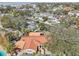 A scenic aerial view showcasing a charming home, lush landscaping, and canal access in a desirable neighborhood at 4829 W San Miguel St, Tampa, FL 33629