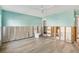 Light blue bathroom, tiled floor, toilet, walls and tub exposed ready for construction or renovation at 4829 W San Miguel St, Tampa, FL 33629