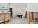 Renovated bathroom showcasing a clawfoot tub, glass shower, and stylish tile work at 4829 W San Miguel St, Tampa, FL 33629