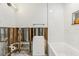 Renovated bathroom with white subway tile, a soaking tub, and modern fixtures at 4829 W San Miguel St, Tampa, FL 33629