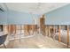Bedroom featuring tiled floor, blue walls, and a ceiling fan for comfort at 4829 W San Miguel St, Tampa, FL 33629