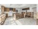Spacious kitchen featuring custom cabinets, large center island and tile backsplash at 4829 W San Miguel St, Tampa, FL 33629