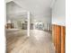Spacious living room featuring tile floors, white walls, and large sliding glass doors to the backyard at 4829 W San Miguel St, Tampa, FL 33629