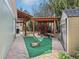 Covered patio with workout equipment and backyard shed at 4829 W San Miguel St, Tampa, FL 33629