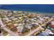 Aerial view of a waterfront neighborhood with a variety of houses and solar panels at 538 25Th Se Ave, St Petersburg, FL 33705