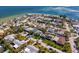 Aerial view of waterfront homes with solar panels and a view of the ocean and city skyline at 538 25Th Se Ave, St Petersburg, FL 33705