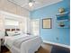 Light blue bedroom with a full-size bed and globe at 538 25Th Se Ave, St Petersburg, FL 33705