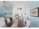 Dining area with white chairs, wooden table, and a view into the kitchen at 538 25Th Se Ave, St Petersburg, FL 33705