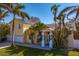 Charming two-story home with solar panels, lush landscaping and a welcoming entrance at 538 25Th Se Ave, St Petersburg, FL 33705