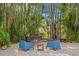 Peaceful fire pit nestled amongst tropical plants and trees at 538 25Th Se Ave, St Petersburg, FL 33705