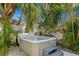 Relax in this hot tub nestled among palm trees in a private backyard oasis at 538 25Th Se Ave, St Petersburg, FL 33705