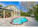 Charming yellow house with a large covered patio and kidney-shaped pool at 538 25Th Se Ave, St Petersburg, FL 33705