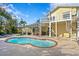 Back view of the house showing a spacious patio, pool and spiral staircase at 538 25Th Se Ave, St Petersburg, FL 33705