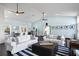 Open living area with hardwood floors, white sofas, and built in shelving at 538 25Th Se Ave, St Petersburg, FL 33705