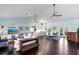 Spacious living room with high ceilings, hardwood floors, and white sofas at 538 25Th Se Ave, St Petersburg, FL 33705