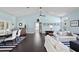 Spacious living area with hardwood floors, white slipcovered sofas, and a dining table at 538 25Th Se Ave, St Petersburg, FL 33705