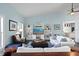 Open living area with hardwood floors, white sofas, and built in shelving at 538 25Th Se Ave, St Petersburg, FL 33705